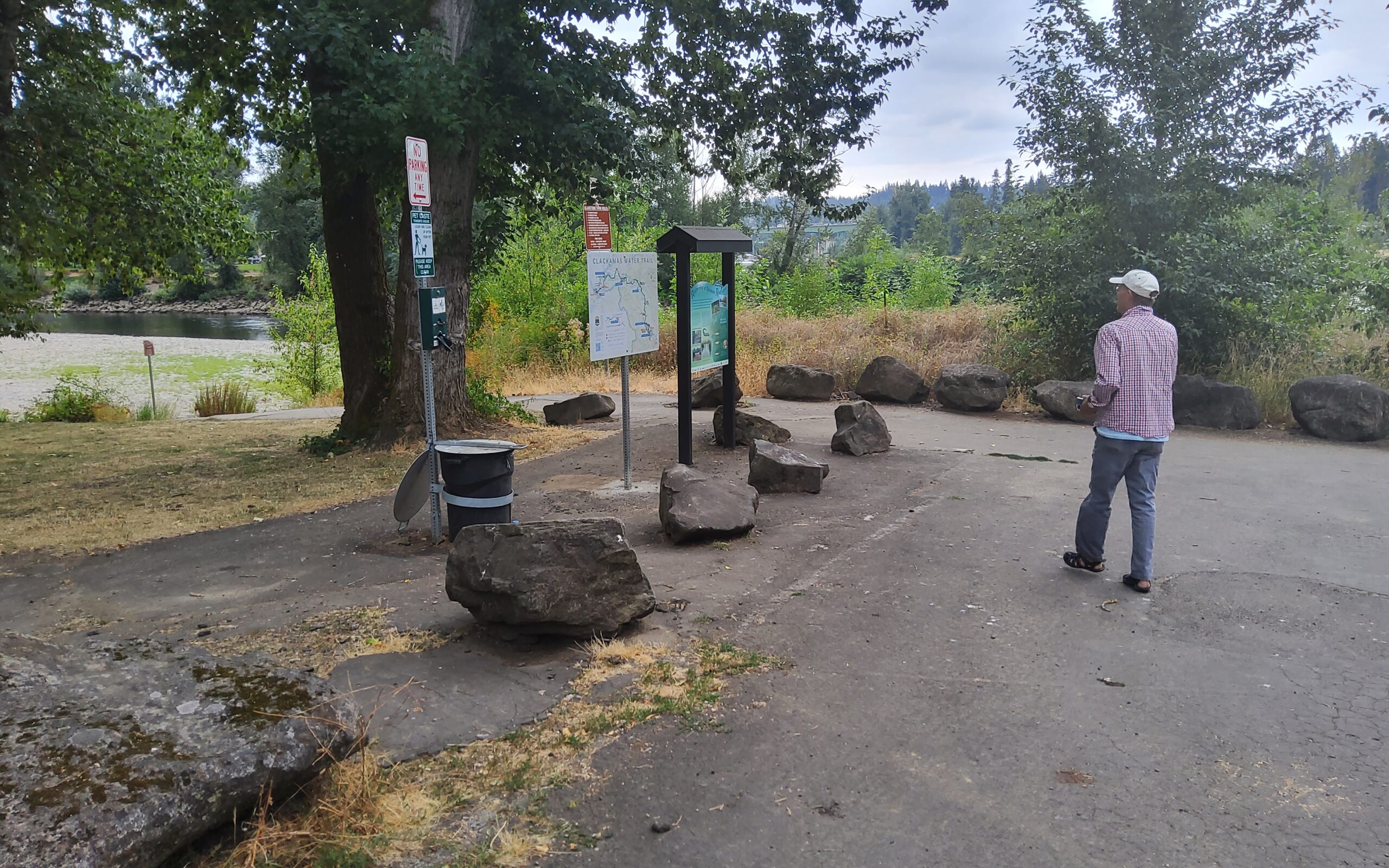 New CWT sign next to informational kiosk on salmon and lamprey, and near access path to the river beach.